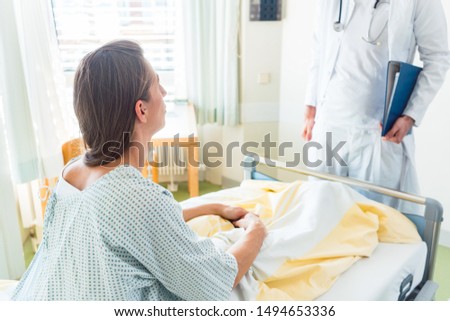 Similar – Doctor giving a prescription to senior patient