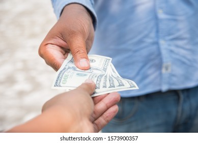 Friendly Deal And Give Lend Money Cash To Pay Shopping Close-up Hands. Person Offer Borrow Money Cash Payout Return Giving Partners Concept.man Success Taking Shopping Deal Trade.friend Receive Salary