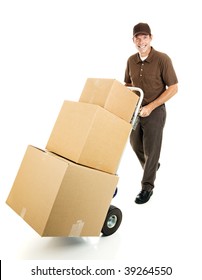 Friendly delivery man or mover pushes a stack of boxes on a hand truck.  Full body isolated.