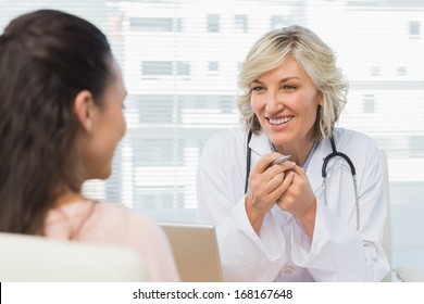 Friendly Female Doctor In Conversation With Patient In The Medical Office