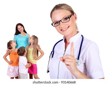 Friendly female doctor and family with children on the background
