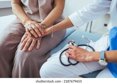 Friendly Female Doctor's Hands Holding Female Patient's Hand For Encouragement And Empathy. Partnership Trust And Medical Ethics Concept. Doctor Giving Hope. 