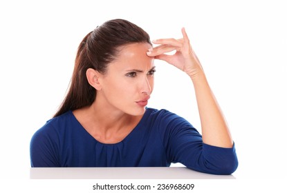 Friendly Girl In Blue Shirt Looking Embarassed In White Background - Copyspace