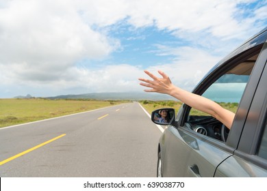 friendly girl sitting on travel car happily reach out hand enjoying own holiday vacation drove stopping on asphalt roadside viewing rural mountain scenery. - Shutterstock ID 639038770