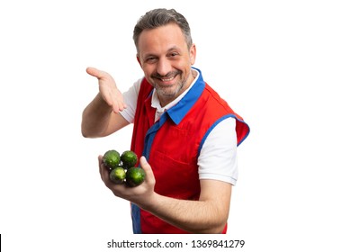 Friendly Grocery Store Or Hypermarket Male Employee Recommending Green Cucumbers With Hand Isolated On White Studio Background