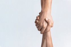 Friendly Handshake, Friends Greeting, Teamwork, Friendship. Close-up. Rescue, Helping Gesture Or Hands. Strong Hold. Two Hands, Helping Hand Of A Friend. Handshake, Arms Friendship