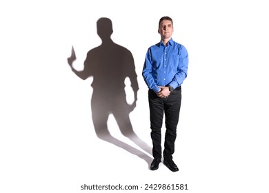 friendly and harmless looking young man whose shadow in the background reveals his evil character