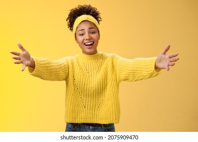 Friendly hospitable charming millennial stylish female hosting party welcoming guest inviting come in extend arms sideways warm welcome hug greeting wanna embrace cuddle, smiling cute - Shutterstock ID 2075909470