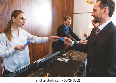 Friendly Hotel Staff Welcoming Guest