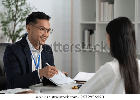 Friendly Insurance Advisor Explaining Options to Client