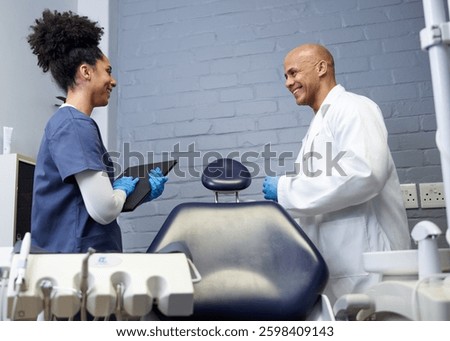 Friendly Interaction Between Dentist and Assistant in a Modern Dental Office