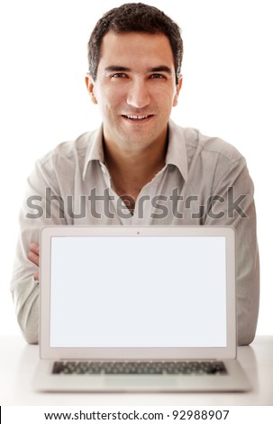 Friendly man with a laptop computer - isolated over a white background