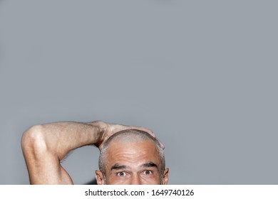  Friendly Mature Man With Short Hair And White Grey Beard, Just Shaved His Hair Over Gray Wall