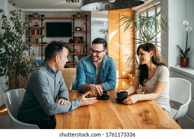 Friendly Meeting. Three People Talking And Having Coffee.