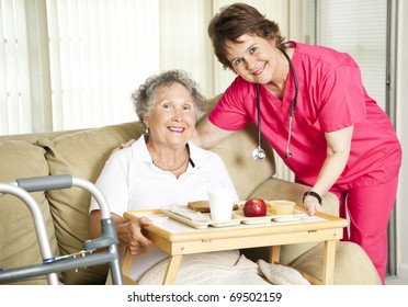 Friendly Nurse Brings A Mean To An Elderly Shut-in.  Could Also Be Lunch Time At The Nursing Home.