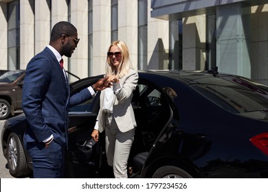 Friendly, Polite Personal Driver Give Hand To Woman To Get Out Of Car, He Brought Blonde Lady To The Final Destination Of Appointments, Gives Attention, Behaves Politely