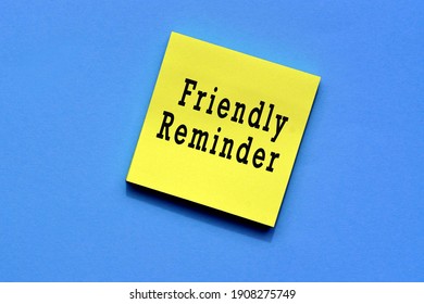 Friendly reminder text on yellow sticky note with blue background