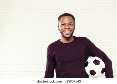 Friendly Smiling Black Man Holding A Football