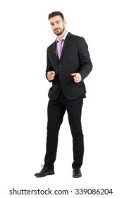 Friendly Smiling Businessman Pointing Finger Hand Gun Sign Towards Camera.  Full Body Length Portrait Isolated Over White Studio Background. 