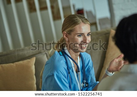 Similar – Pretty female doctor in a geriatric clinic with elderly woman in wheelchair