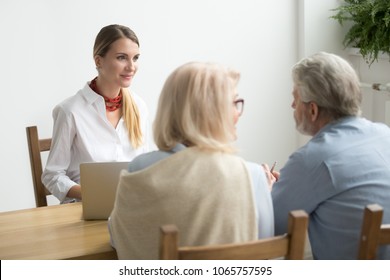 Friendly Smiling Lawyer Consulting Older Clients, Senior Couple Asking Advice About Making Investment At Meeting With Female Financial Advisor Or Bank Worker, Consultation Or Job Interview Concept