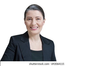 Friendly Smiling Middle Aged Woman In A Black Blazer Isolated On White Background, Professor, Teacher, Translator, Lawyer, Attorney, Accountant Or Businesswoman