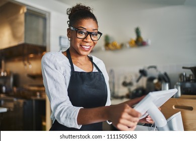 Friendly Smiling Shop Assistant Ready To Take Order On Pos Terminal In Restaurant