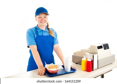 Friendly, smiling teenage cashier serving fast food in a restaurant.  Isolated on white.  