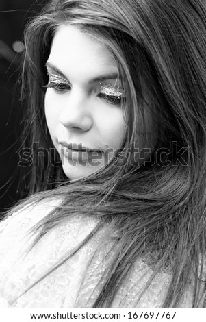 Friendly smiling young woman portrait studio shot
