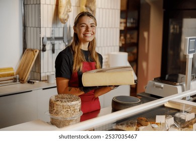 A friendly staff member is showcasing a range of gourmet cheese and various artisan products within a vibrant shop - Powered by Shutterstock