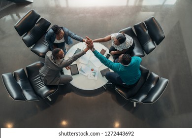 Friendly successful all african business team give high five together in office, excited happy employees celebrating corporate victory, african workers teambuilding concept