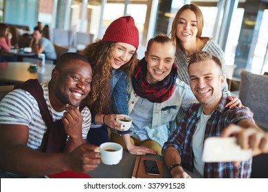 Friendly Teenagers Making Selfie In Cafe