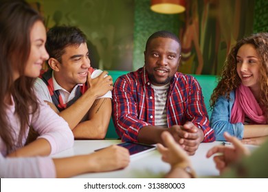 Friendly Teens Talking In Cafe