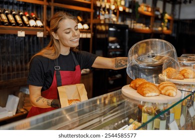 In a friendly and vibrant cafe atmosphere, a cheerful barista offers an assortment of fresh pastries daily - Powered by Shutterstock