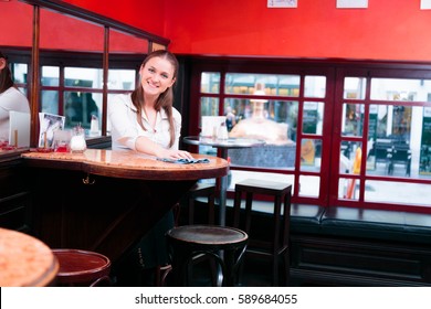 Friendly Waiter Taking Cleaning The Tables