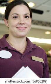 Friendly Waitress At Diner With Menus