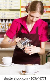 Friendly Waitress Making Coffee At Coffee Machine