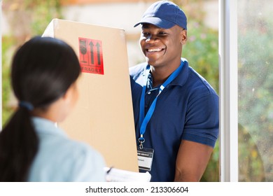 Friendly Young African American Delivery Man Delivering A Package