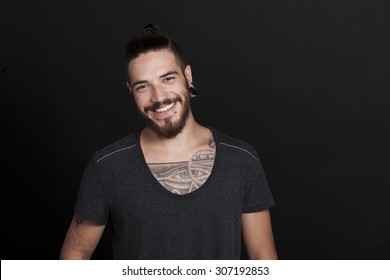 Friendly Young Tattoo Man With Pony Tail