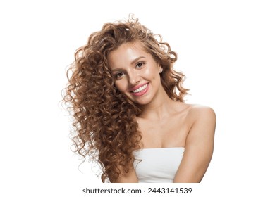 Friendly young woman with natural make-up, clear fresh skin and wavy hairstyle on white background - Powered by Shutterstock