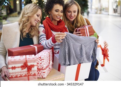 Friends After Christmas Shopping In The Store