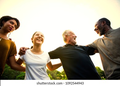 Friends Of All Ages Holding Hands