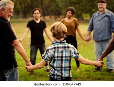 Friends Of All Ages Holding Hands