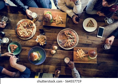 Friends all together at restaurant having meal - Powered by Shutterstock