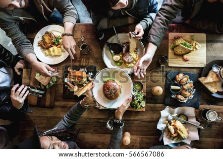 Friends all together at restaurant having meal