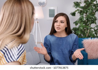 Friends Arguing On Sofa At Home