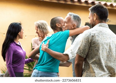 Friends arriving to garden dinner party. Hosts welcoming guests. - Powered by Shutterstock