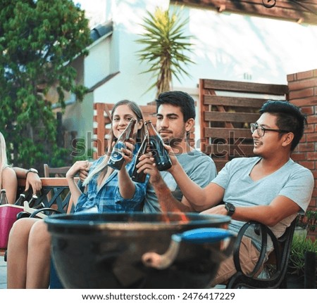 Similar – Woman holding lemonade glass and friends cooking in barbecue