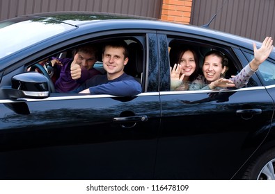 Friends In A Black Car Going In Vocation