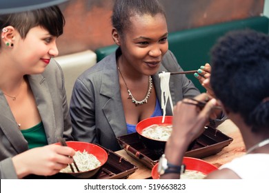 Friends, Black And Latin People, Eating Ramen Noodle Soup In Japanese Restaurant